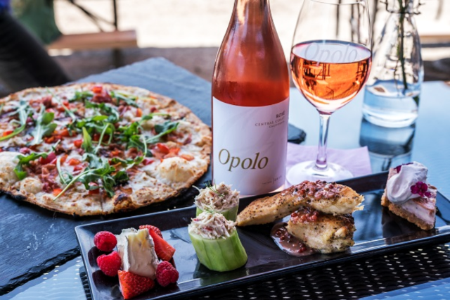 Dining at Opolo Vineyards in Paso Robles. Pictured wine bottle
