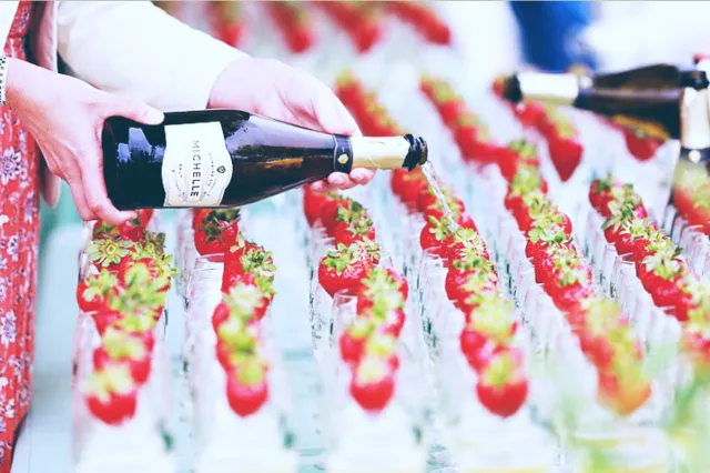 Glass of Wine Being Filled Up with Red Wine From A Bottle at the Santa Barbara Food & Wine Festival