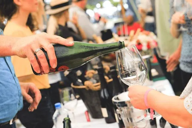 Pictured is a wine pour at the festival grounds of the Santa Barbara Vintner's Festival